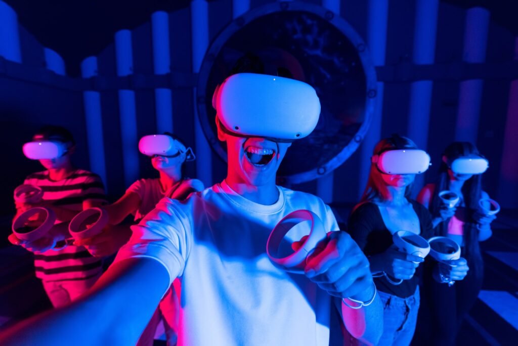A team of young friends taking selfie while using virtual reality VR equipment on a arena